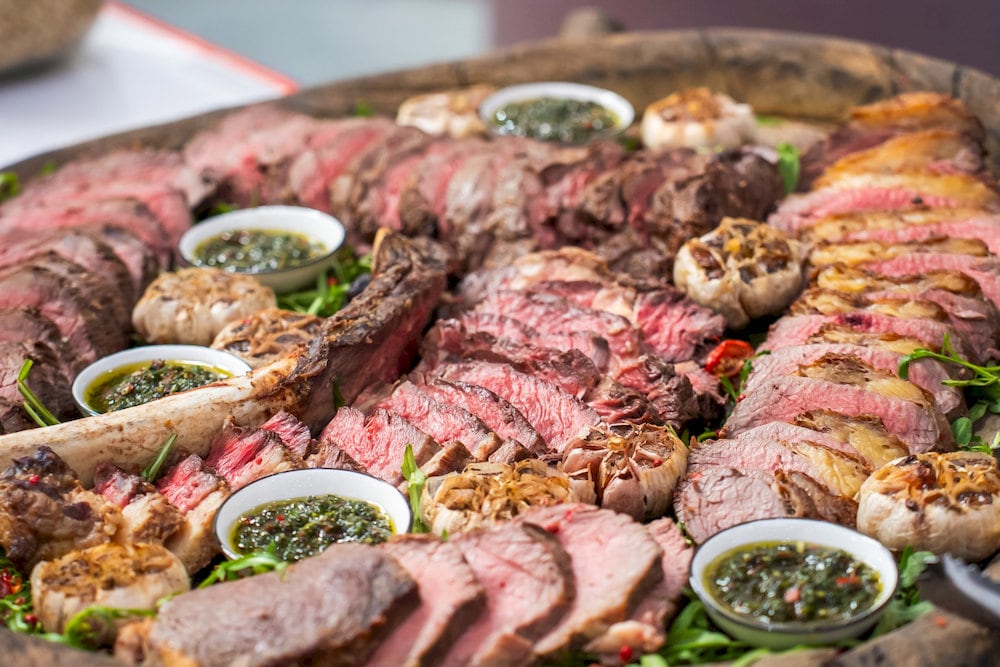 The steaks are wood-fired over oak, delivering bold flavor and smoky aroma